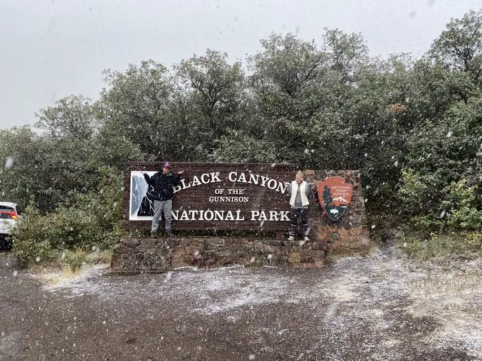 black canyon of the gunnison sign in snow